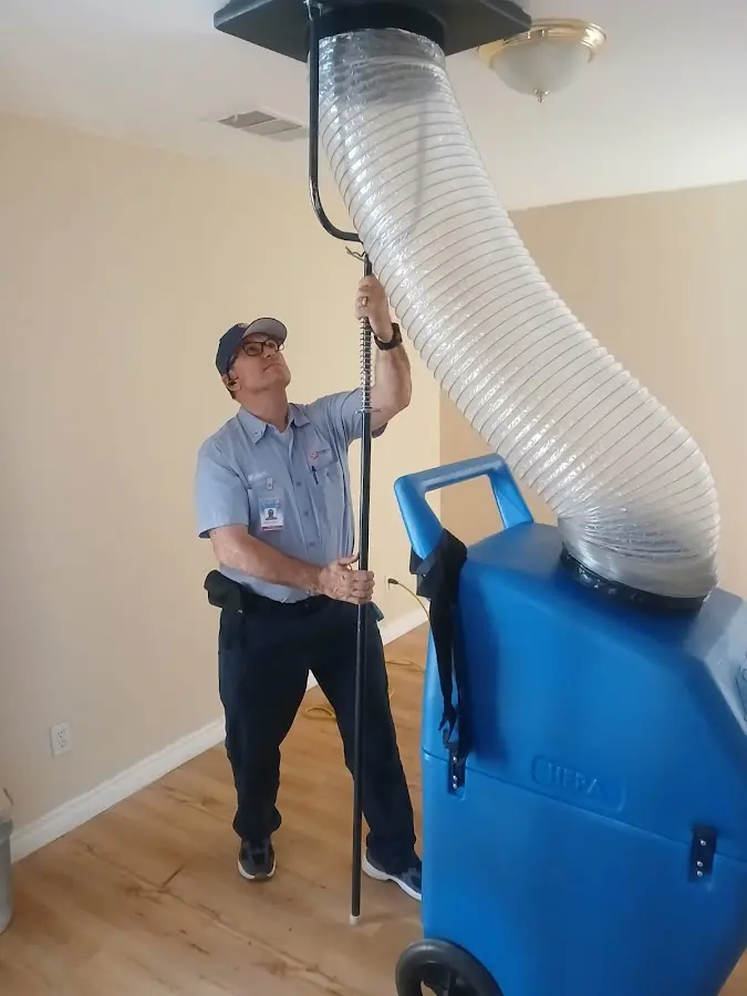 Furnace Tune-Up technician using HEPA equipment in Contra Costa Centre